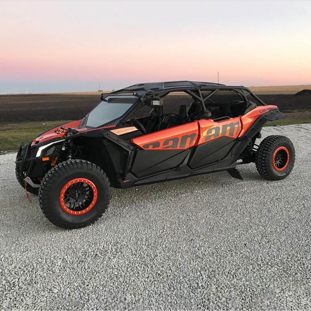 The image shows a rugged, black and orange ATV ready for off-road adventures.
AI-generated content may be incorrect.