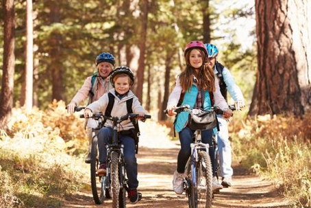 Grandkids riding bikes with grandparents